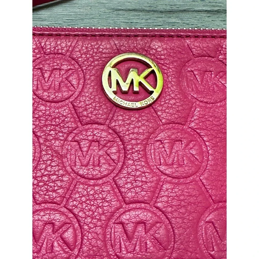 Michael Kors Fuchsia Embossed MK Logo Wristlet with Gold Accent